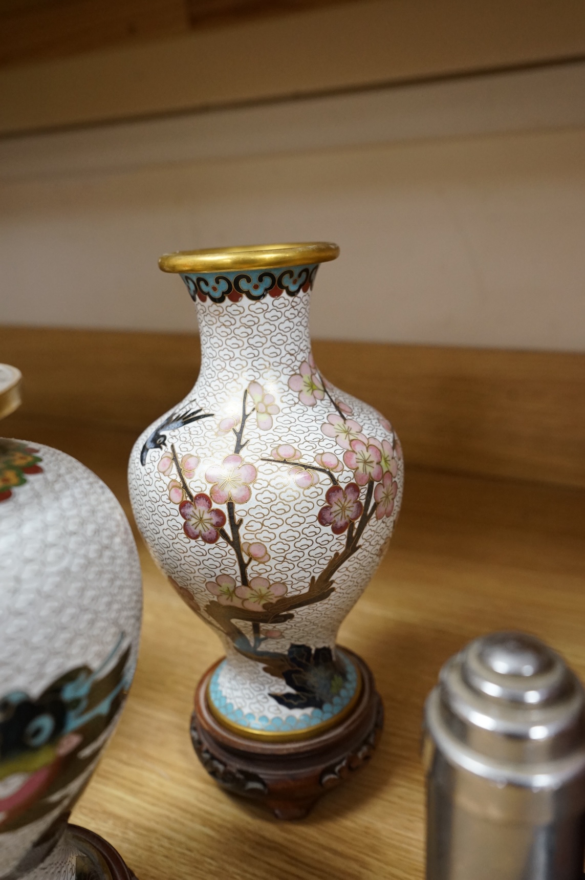 A plique a jour enamel tea bowl together with a collection of cloisonné enamel vases, bowls etc., tallest 26cm